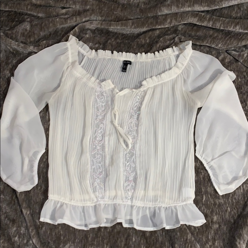 White ruffle blouse with sequin